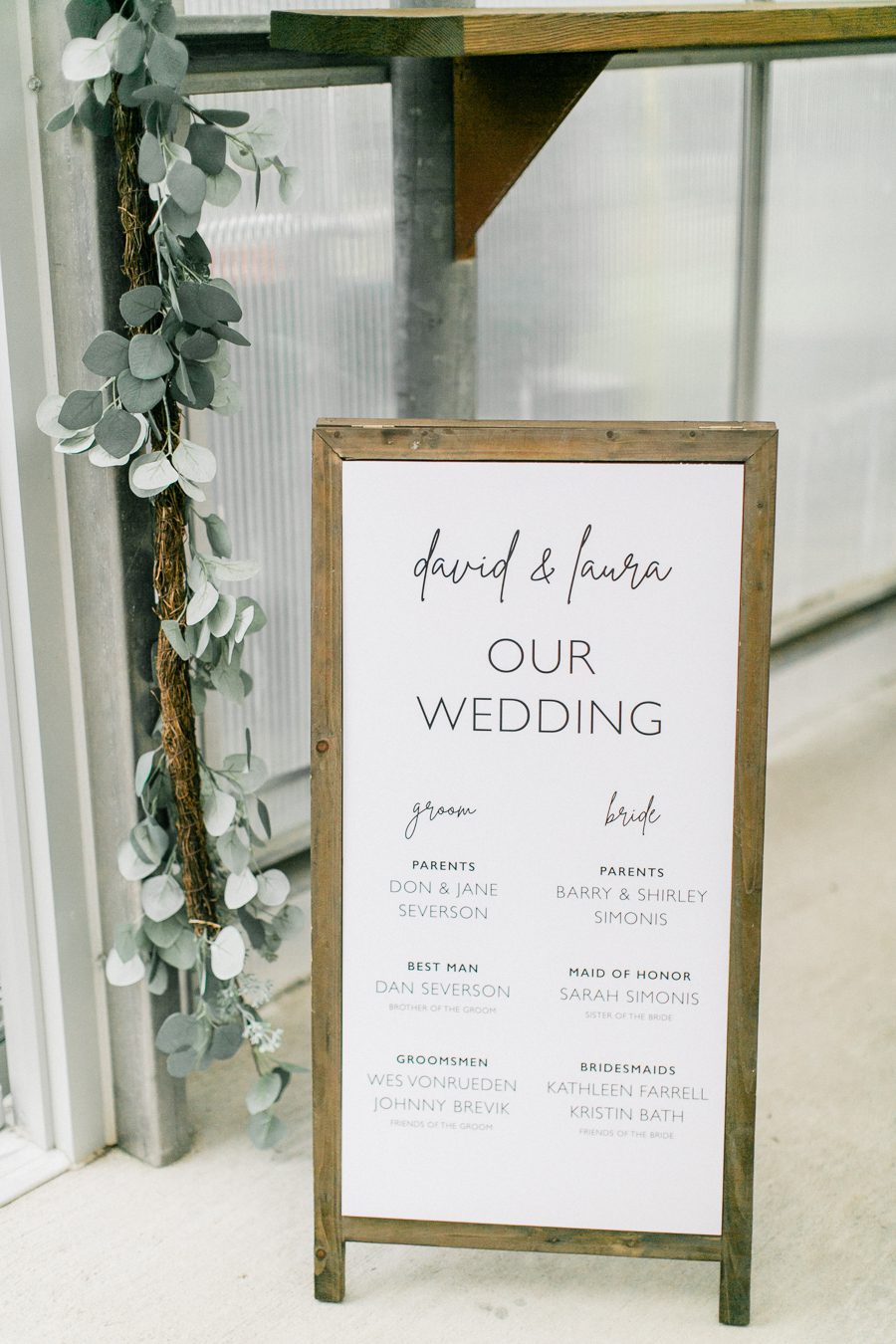 modern greenhouse wedding photos, carly mccray photography, lake geneva wedding photographer, madison wedding photographers, modern greenery wedding, modern wisconsin greenhouse wedding, modern greenery wedding, sleek wedding dress, greenery boutonnieres, black taper candles, green florals, modern greens