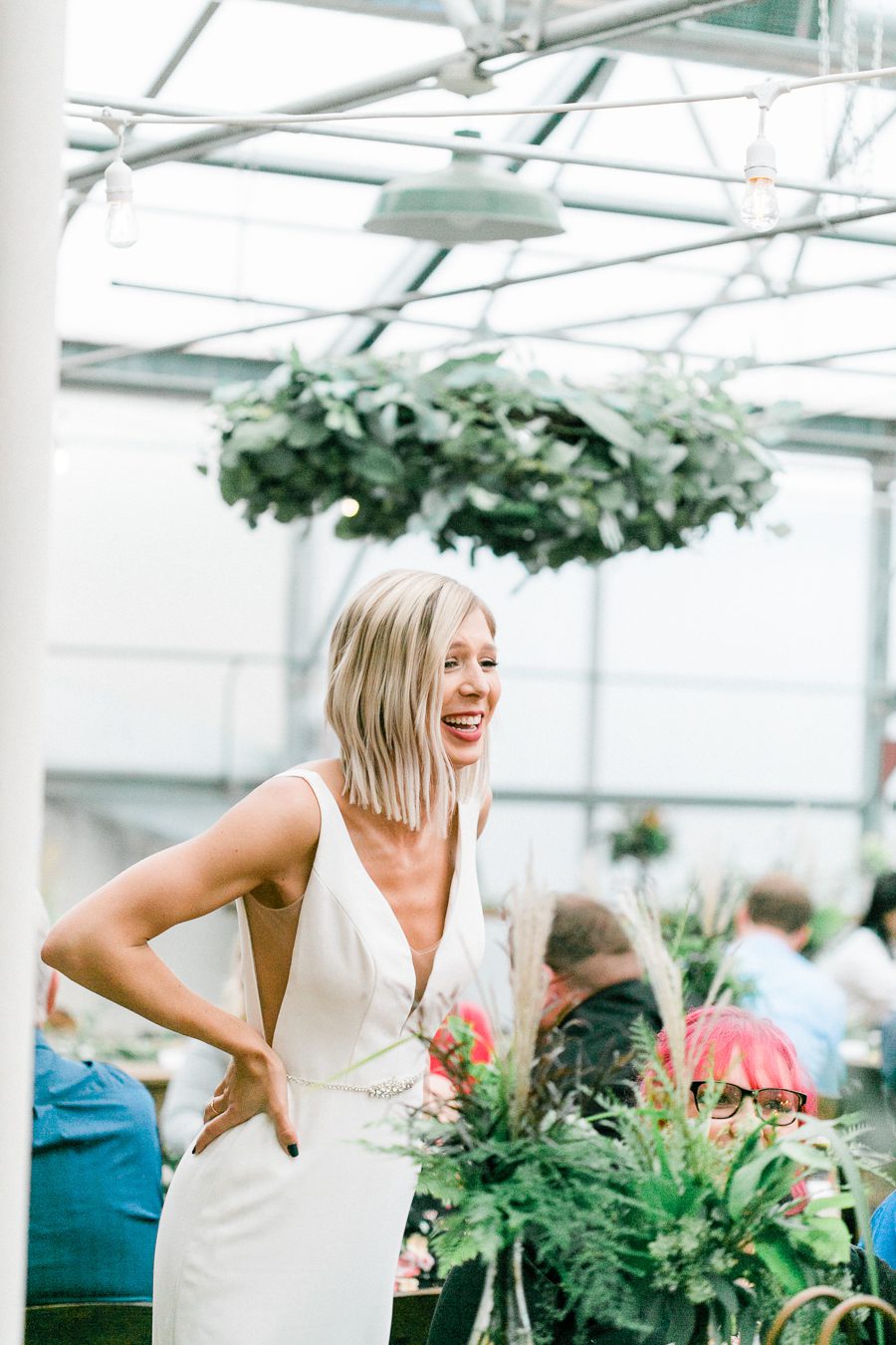 modern greenhouse wedding photos, carly mccray photography, lake geneva wedding photographer, madison wedding photographers, modern greenery wedding, modern wisconsin greenhouse wedding, modern greenery wedding, sleek wedding dress, greenery boutonnieres, black taper candles, green florals, modern greens